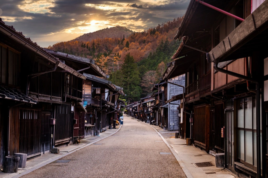A quiet Kyoto back lane with wooden façades.